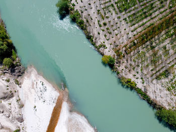 High angle view of water flowing through rocks