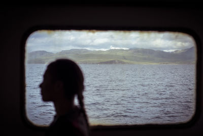 Silhouette of female passenger on scottish ferry