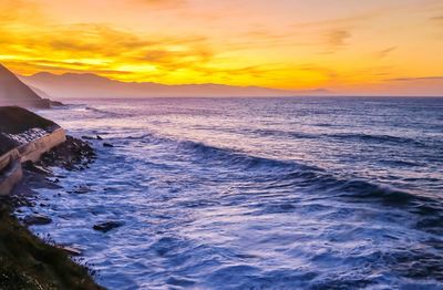 Scenic view of sea against sky during sunset