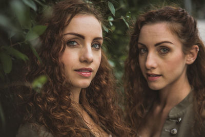 Portrait of siblings against plants