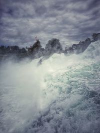 Scenic view of sea against cloudy sky