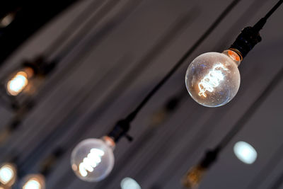 Low angle view of illuminated light bulb