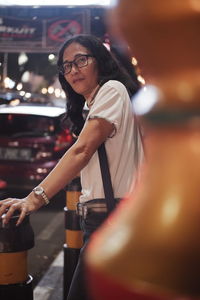 Portrait of a woman on the street at saturday night