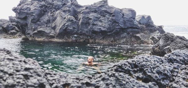 Man swimming in sea