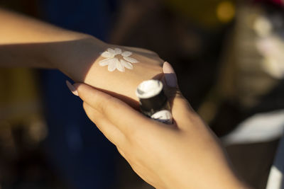 Close-up of woman holding hands