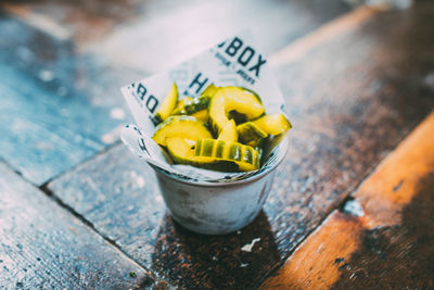 Close-up high angle view of yellow juice on table