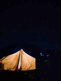 View of tent against star field at night