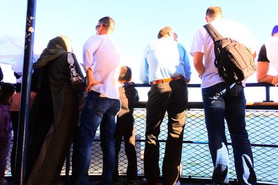 People standing against clear sky