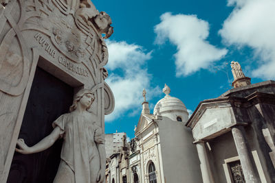 Low angle view of statue against sky