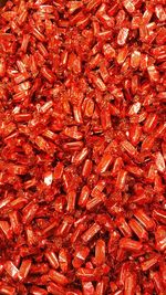 Full frame shot of red hard candies for sale