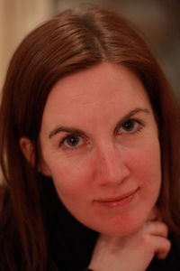 Close-up portrait of a smiling young woman