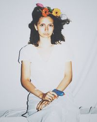 Portrait of young woman looking at camera