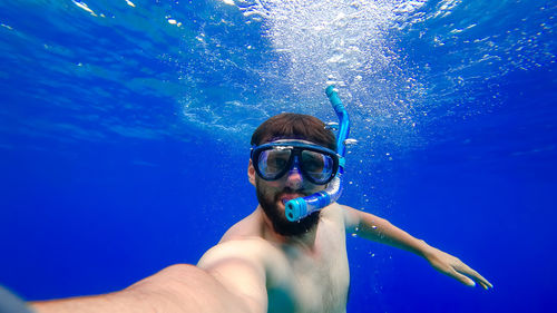 Portrait of man swimming in sea