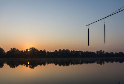 Reflection of trees in calm lake