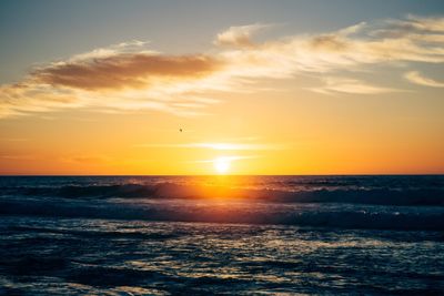 Scenic view of sea at sunset