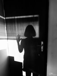 Woman standing in corridor