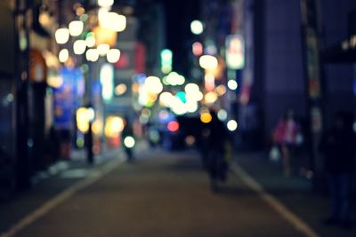 Defocused image of illuminated city street