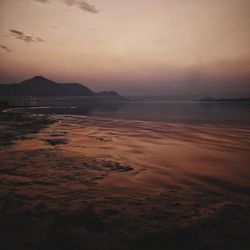 Scenic view of sea against sky at sunset