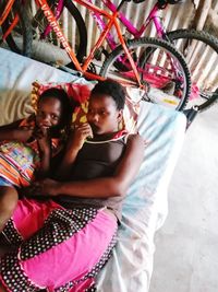 High angle view of girl sitting on floor