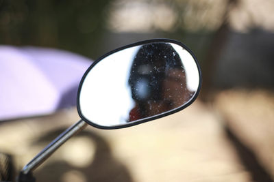 Close-up of sunglasses on mirror