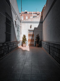 Alley amidst buildings in city