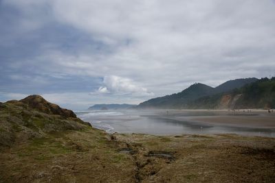 Scenic view of beach and mountain