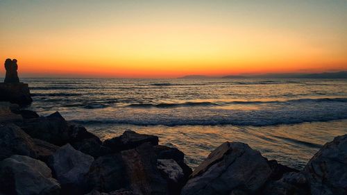 Scenic view of sea against sky during sunset