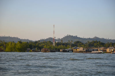 Scenic view of factory against clear sky