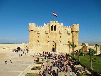 Group of people in front of historical building