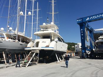 Man at harbor against clear sky