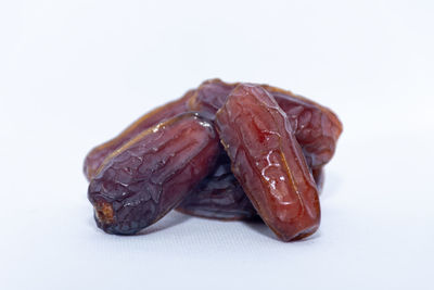 Close-up of meat against white background