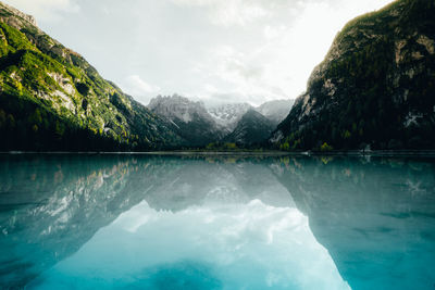 Scenic view of lake and mountains against sky