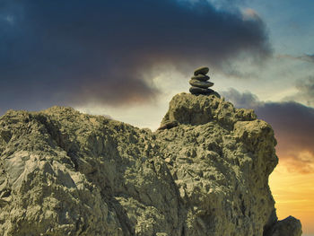 Rock formations on mountain against sky