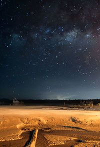 Scenic view of landscape against sky at night