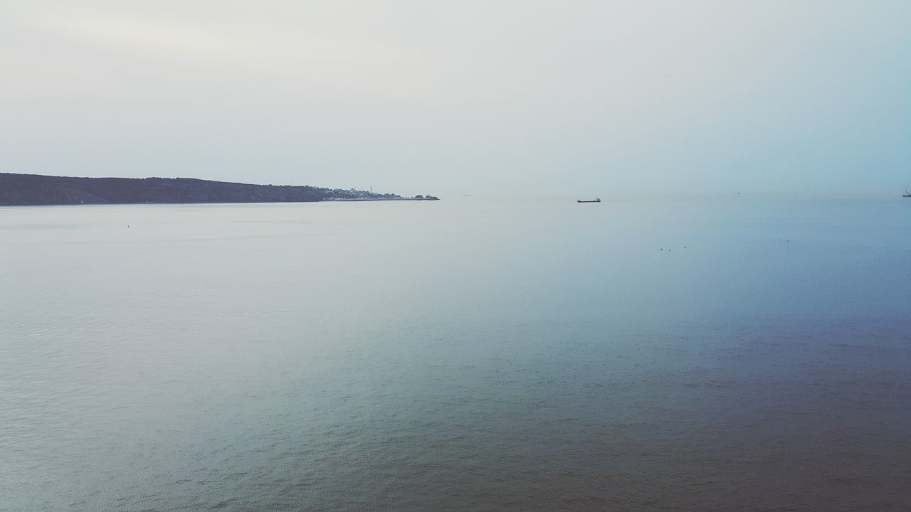 sea, water, tranquil scene, tranquility, horizon over water, scenics, copy space, clear sky, beauty in nature, beach, nature, sand, shore, idyllic, sky, calm, remote, non-urban scene, outdoors, waterfront