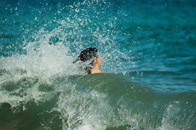 Man swimming in sea