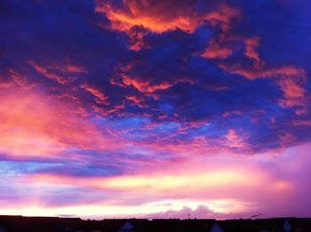 Scenic view of landscape against cloudy sky