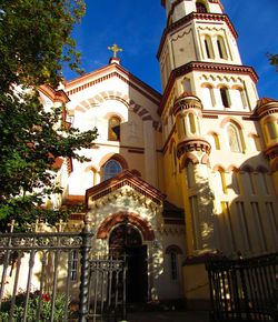 Low angle view of church and building against sky