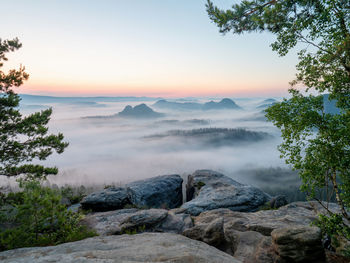 Scenic view of mountains against sky during sunset