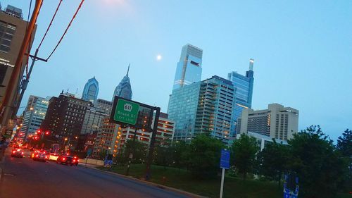 City street and modern buildings against sky