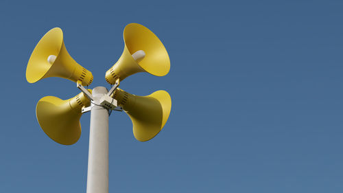 Low angle view of plant against clear blue sky