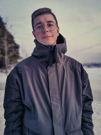 Portrait of smiling man standing outdoors