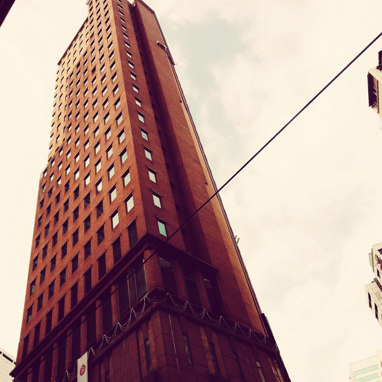 architecture, low angle view, built structure, building exterior, sky, city, tall - high, tower, building, modern, office building, skyscraper, day, outdoors, no people, window, tall, cloud - sky, directly below, cloud