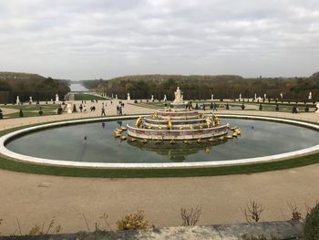 View of fountain in city against sky