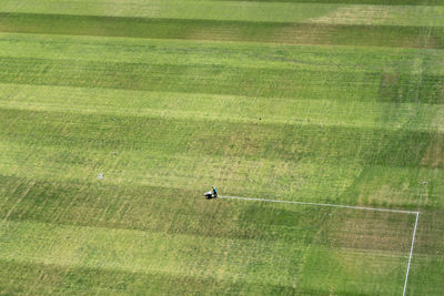 Aerial view of person making yard lines at soccer field