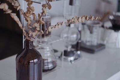 Close-up of glass bottle on table