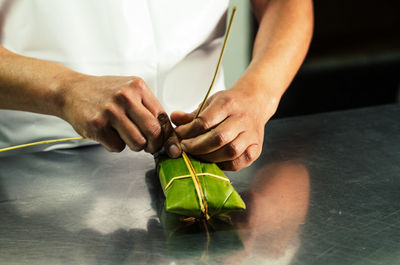 Midsection of man holding food