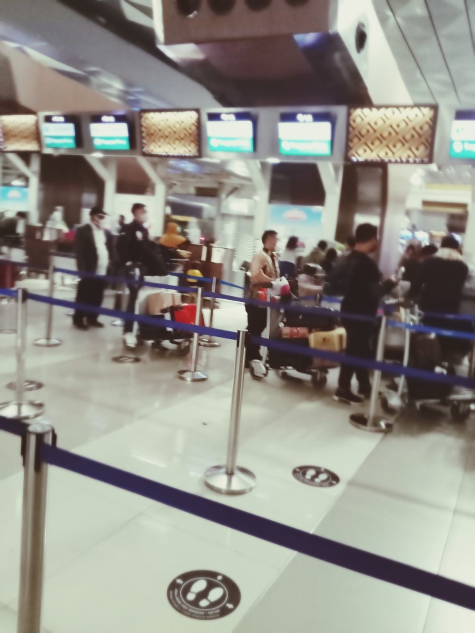 group of people, travel, crowd, large group of people, transportation, indoors, passenger, room, women, airport, adult, men, mode of transportation, journey, public transportation, lifestyles, architecture, airport departure area, motion, communication, business, commuter, city life, seat, city