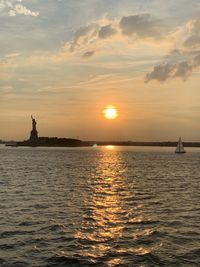 The statue of liberty scenic view during sunset