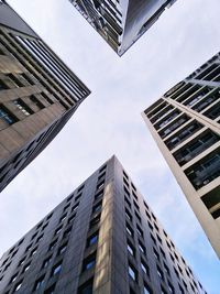 Low angle view of office building against sky